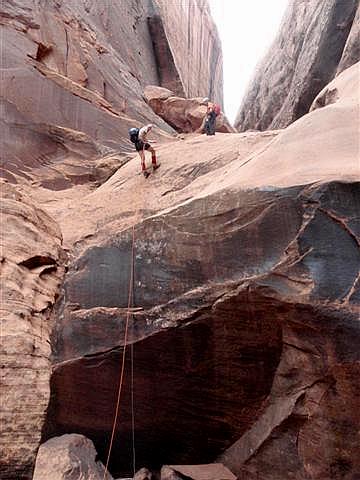 Mark on the final rappel with Bruce watching.