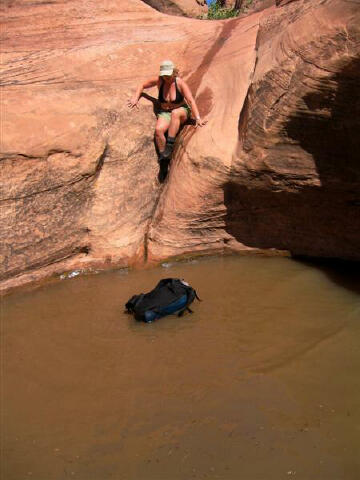 Shauna downclimbs into the second pothole.