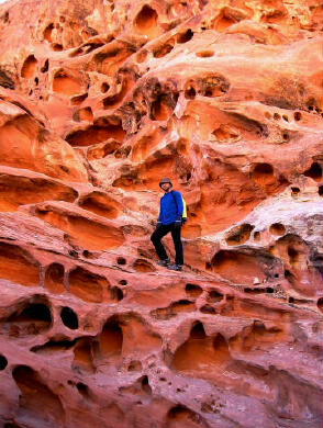 Hank Moon climbs an interesting formation in Ding Canyon