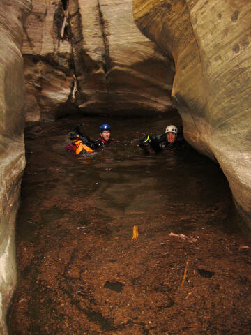 Giles Wallace and Jeff Meierhofer swimming through scum.